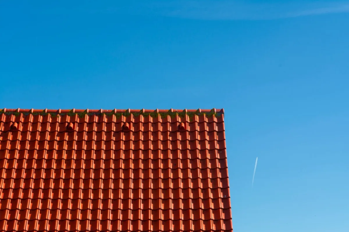 Tile roof gable in full sun, the kind of exposure that sets roof life in Newton, MA